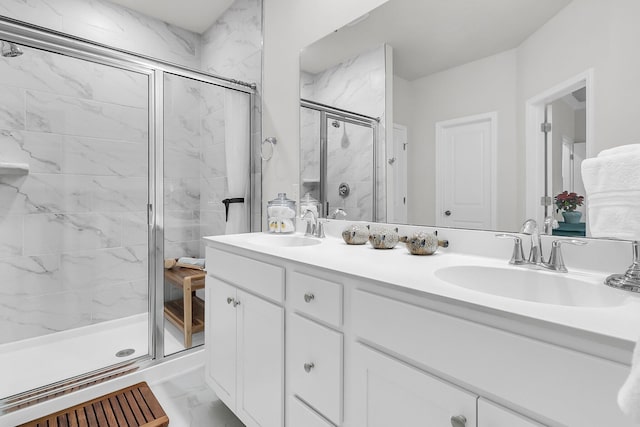 bathroom featuring vanity and an enclosed shower