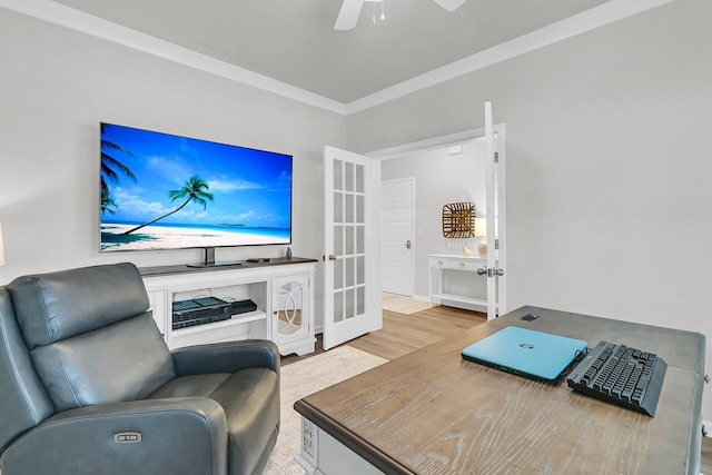 living room with crown molding, ceiling fan, and hardwood / wood-style flooring