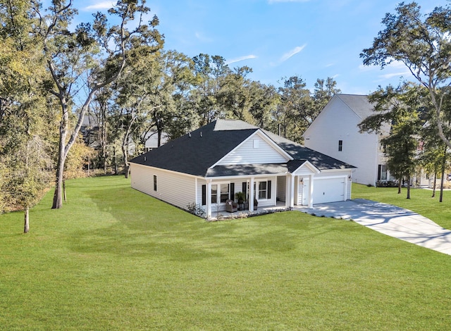 view of front facade with a garage, covered porch, and a front yard