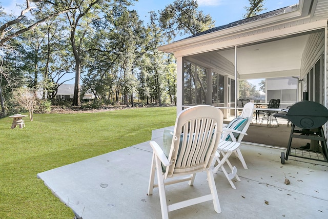 view of patio with a sunroom and area for grilling