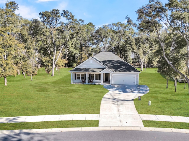 view of front of property featuring covered porch, a garage, and a front lawn