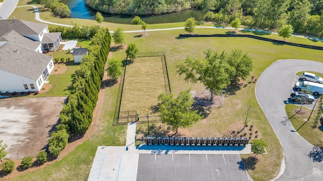 birds eye view of property with a water view