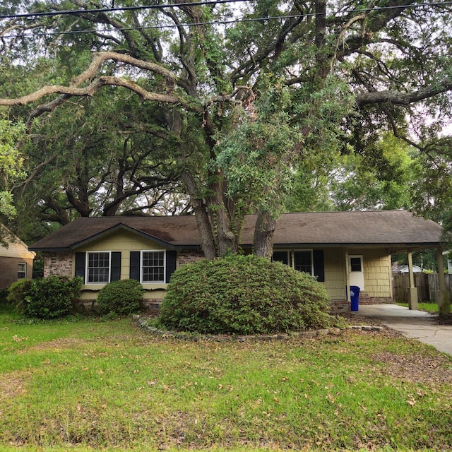 1601 Westmoreland Ave, Charleston, SC 29412 - ranch-style house featuring an attached carport, concrete driveway, and brick siding