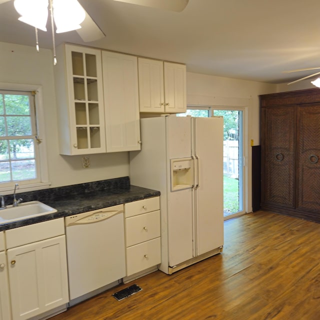 1601 Westmoreland Ave, Charleston, SC 29412 - kitchen featuring white appliances, ceiling fan, a sink, and dark wood-style flooring