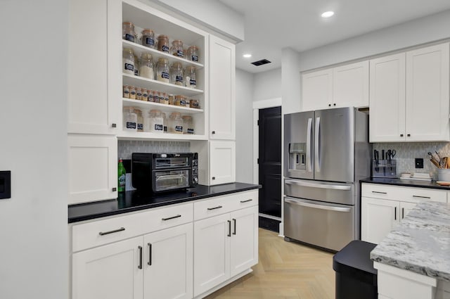 kitchen featuring open shelves, white cabinetry, stainless steel refrigerator with ice dispenser, and recessed lighting