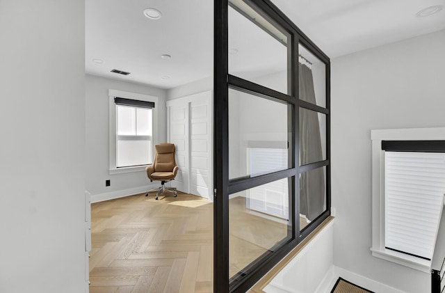 interior space with baseboards, visible vents, and recessed lighting