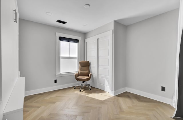 living area featuring visible vents and baseboards