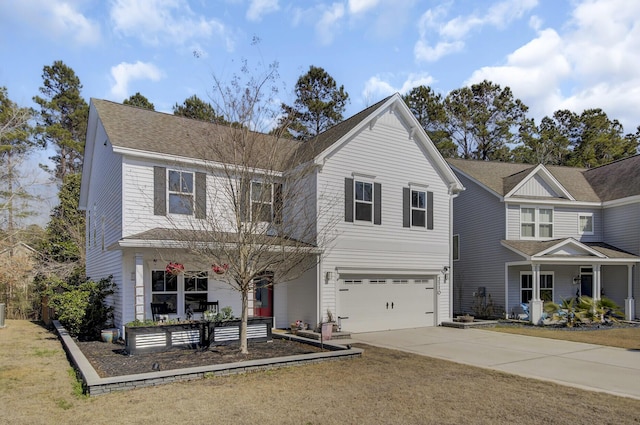 traditional-style house with a garage, driveway, a shingled roof, and a porch