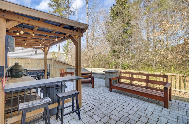 view of patio / terrace with fence, area for grilling, and outdoor dining space