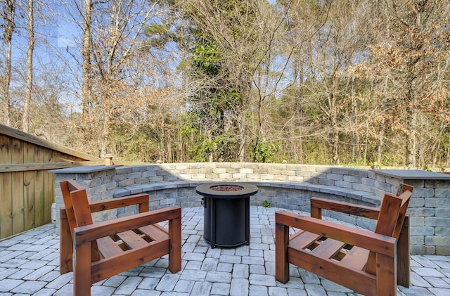 view of patio featuring a fire pit