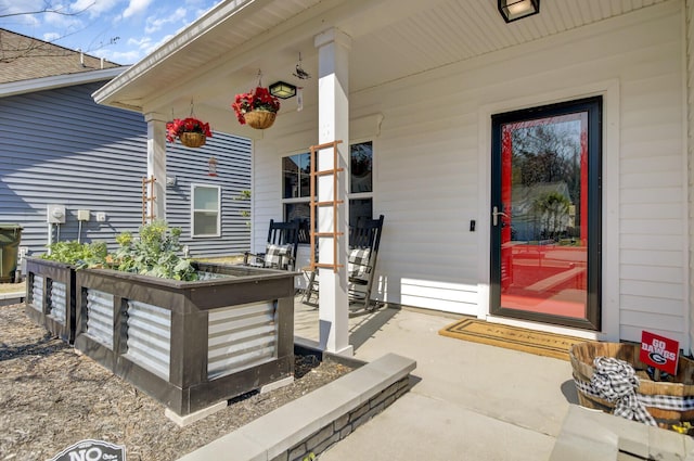 doorway to property with a porch