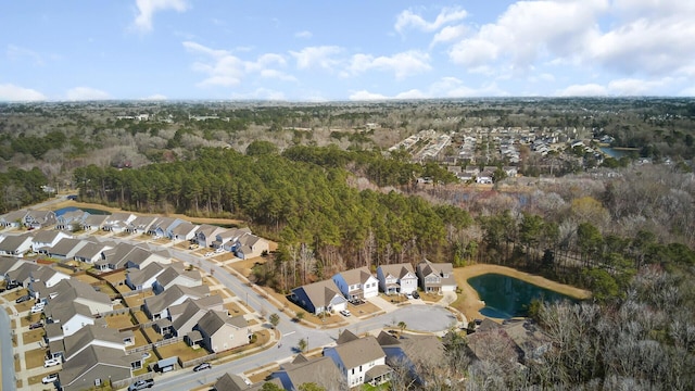 birds eye view of property featuring a residential view and a forest view