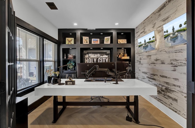 office area featuring an accent wall, built in features, and recessed lighting