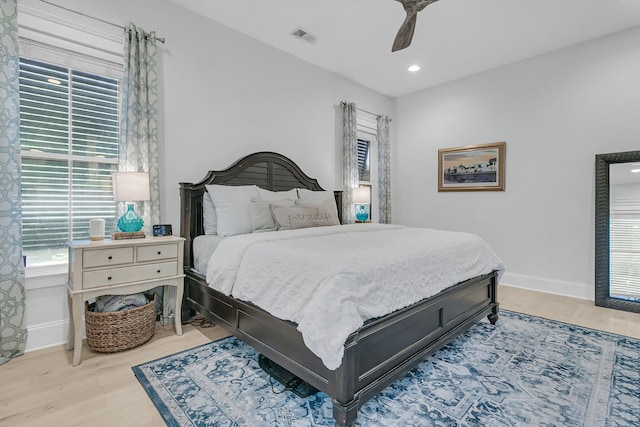 bedroom featuring light wood finished floors, baseboards, ceiling fan, and recessed lighting
