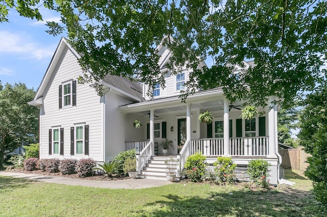 view of front of property featuring a ceiling fan and a porch