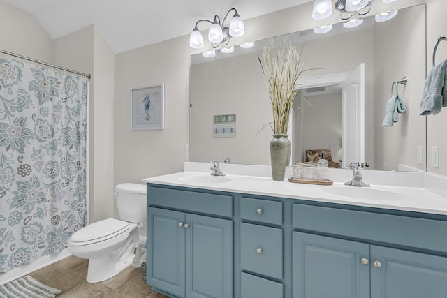 bathroom featuring toilet, double vanity, and a shower with shower curtain