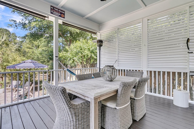 wooden deck featuring outdoor dining area