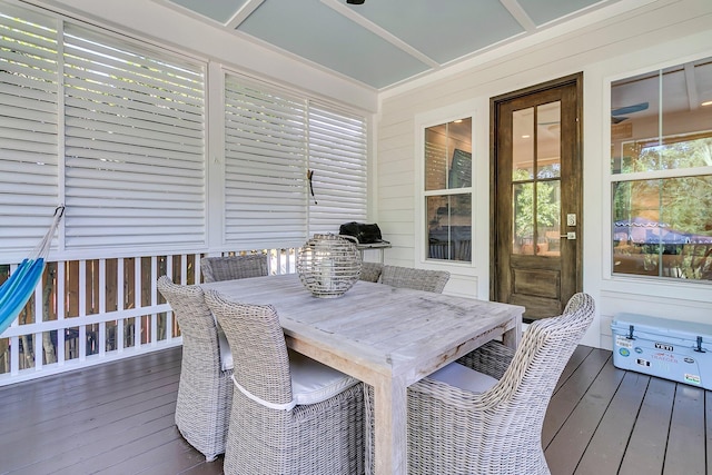sunroom / solarium with outdoor dining space