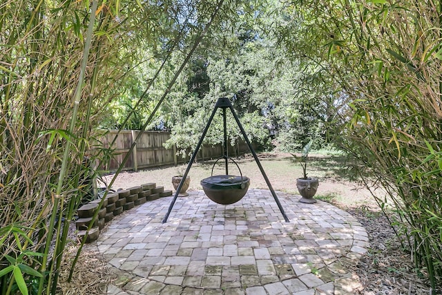 view of patio with a fenced backyard and a playground