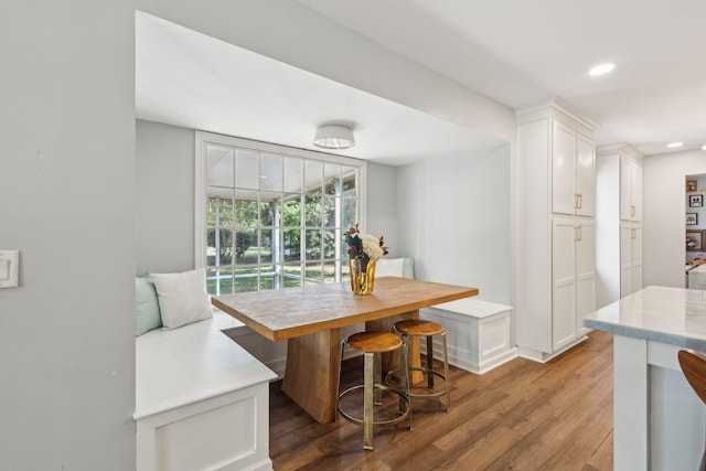 dining area featuring dark wood-type flooring