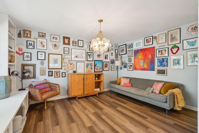 sitting room with a chandelier and wood-type flooring