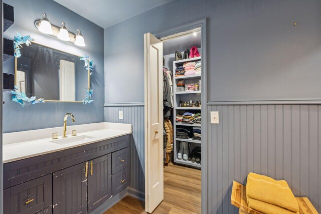 bathroom with vanity and hardwood / wood-style flooring