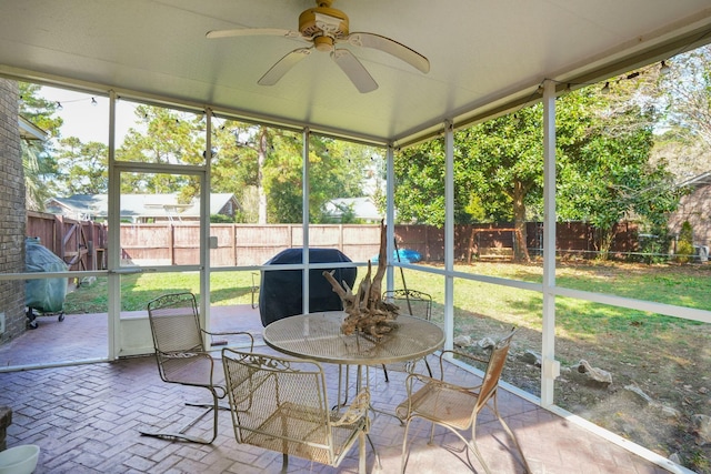 sunroom / solarium with ceiling fan