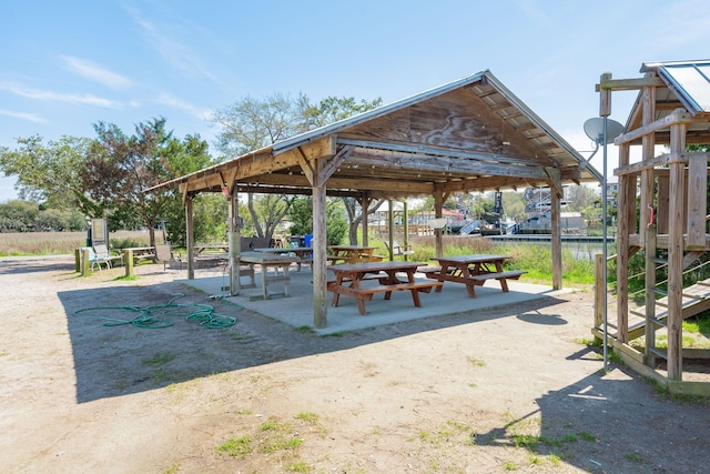 view of property's community featuring a water view and a gazebo