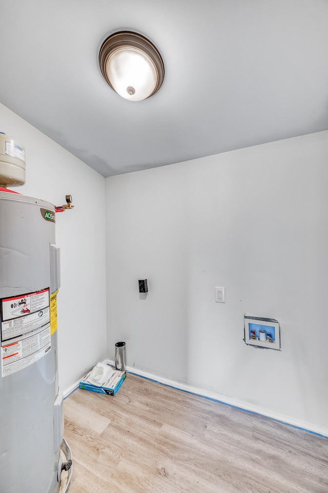 utility room with electric water heater