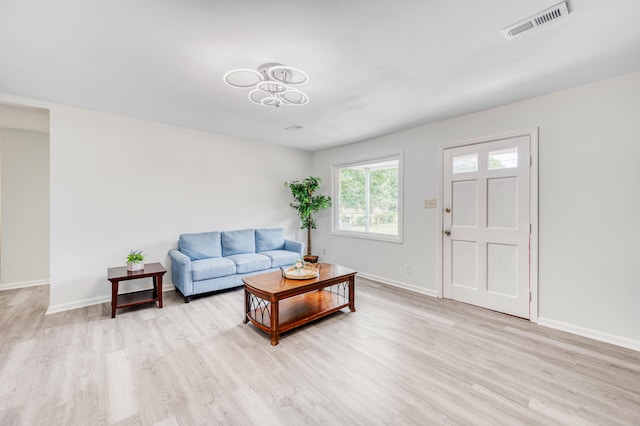 living room with light hardwood / wood-style floors