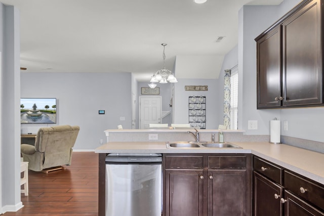 kitchen with dishwasher, sink, kitchen peninsula, a chandelier, and decorative light fixtures