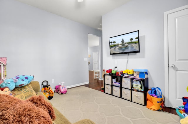 playroom with dark hardwood / wood-style floors