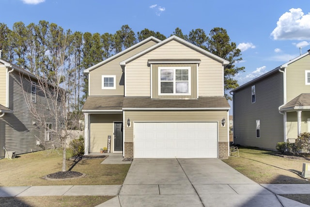 view of property with a front yard and a garage