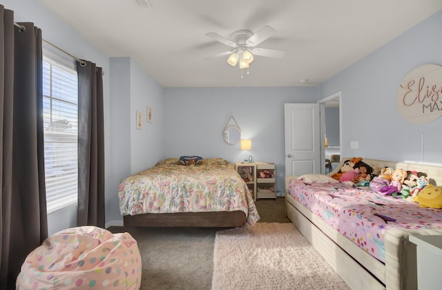 carpeted bedroom featuring ceiling fan