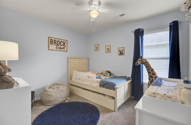 bedroom featuring ceiling fan and light colored carpet