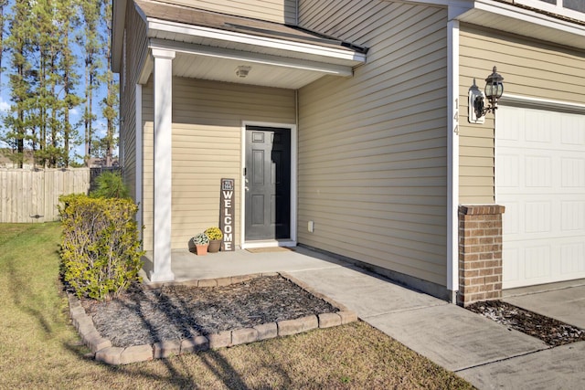 view of exterior entry featuring a garage