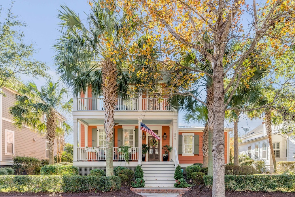 view of front of home featuring a balcony