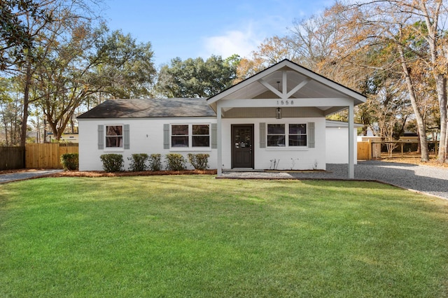 single story home featuring a front yard