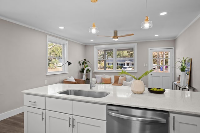 kitchen with sink, hanging light fixtures, dishwasher, light stone countertops, and white cabinets