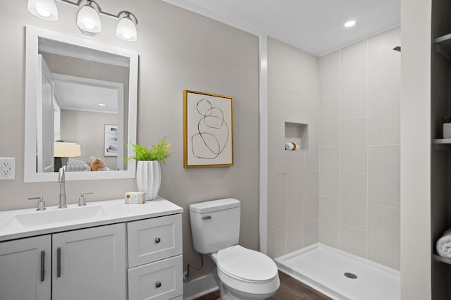 bathroom with vanity, toilet, and walk in shower