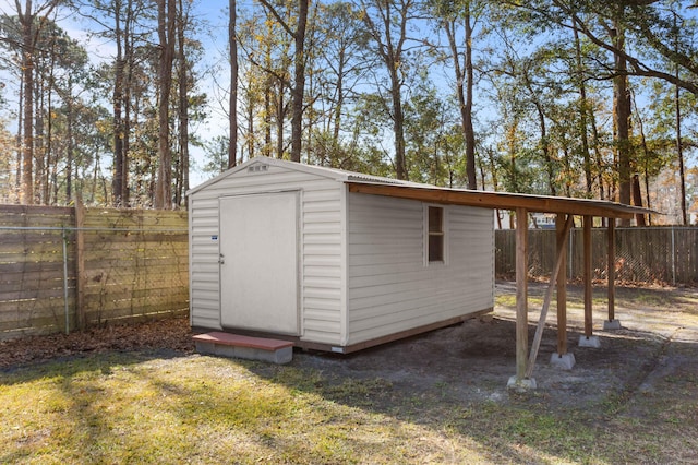 view of outbuilding featuring a lawn