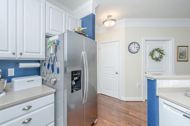 kitchen with ornamental molding, dark wood-type flooring, white dishwasher, light countertops, and stainless steel refrigerator with ice dispenser