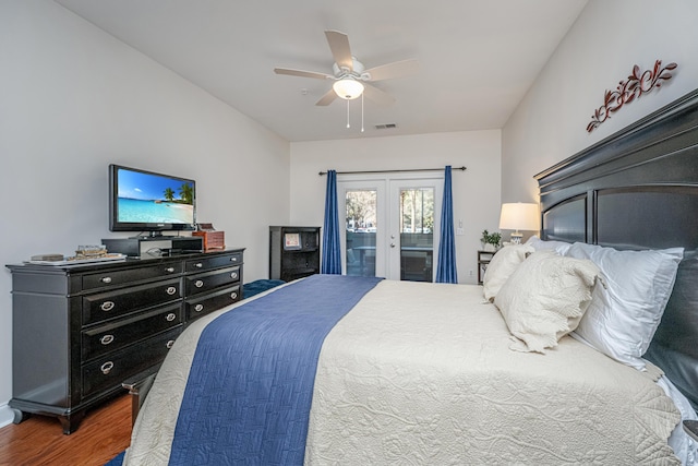 bedroom featuring french doors, visible vents, ceiling fan, wood finished floors, and access to outside