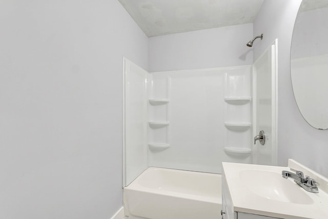 bathroom featuring  shower combination and vanity