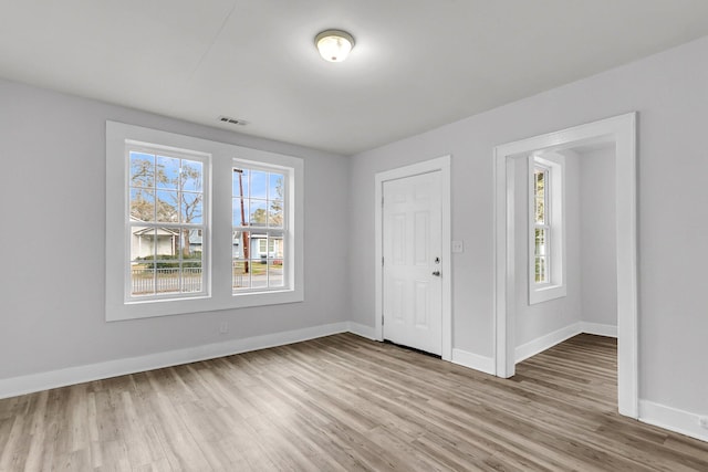 unfurnished bedroom with a closet and light hardwood / wood-style flooring