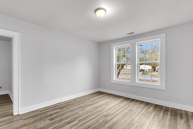 spare room featuring light wood-type flooring