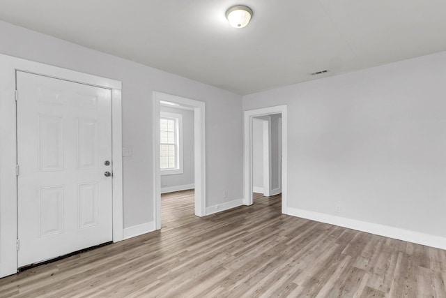 entryway with light hardwood / wood-style floors