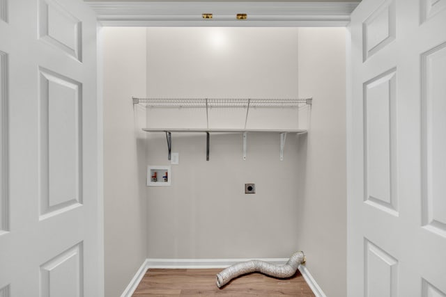 washroom featuring hardwood / wood-style flooring, washer hookup, and electric dryer hookup