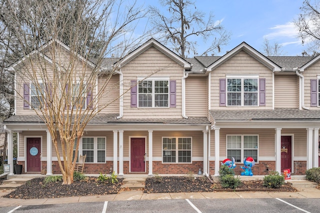 multi unit property featuring a porch