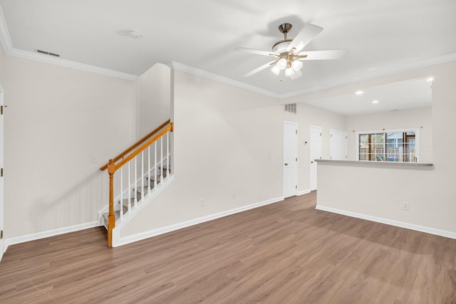 unfurnished living room with ceiling fan, wood-type flooring, and crown molding